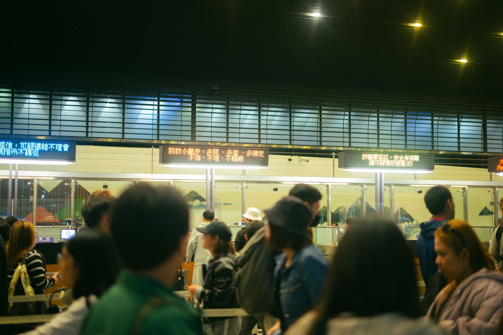 Applicants queuing at a visa application counter