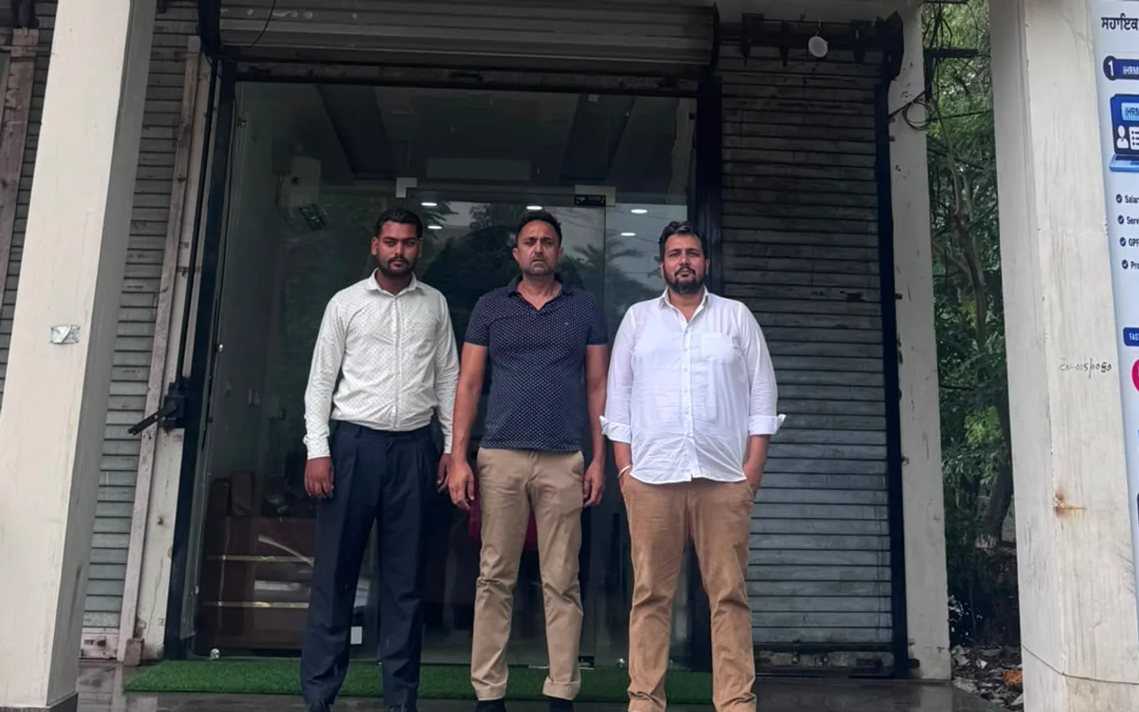 Rohit Gir, Narinderpal Singh Chahal and Sherbir Singh Grewal outside the ground-floor Lifeset Overseas office on Nabha Road, Patiala
